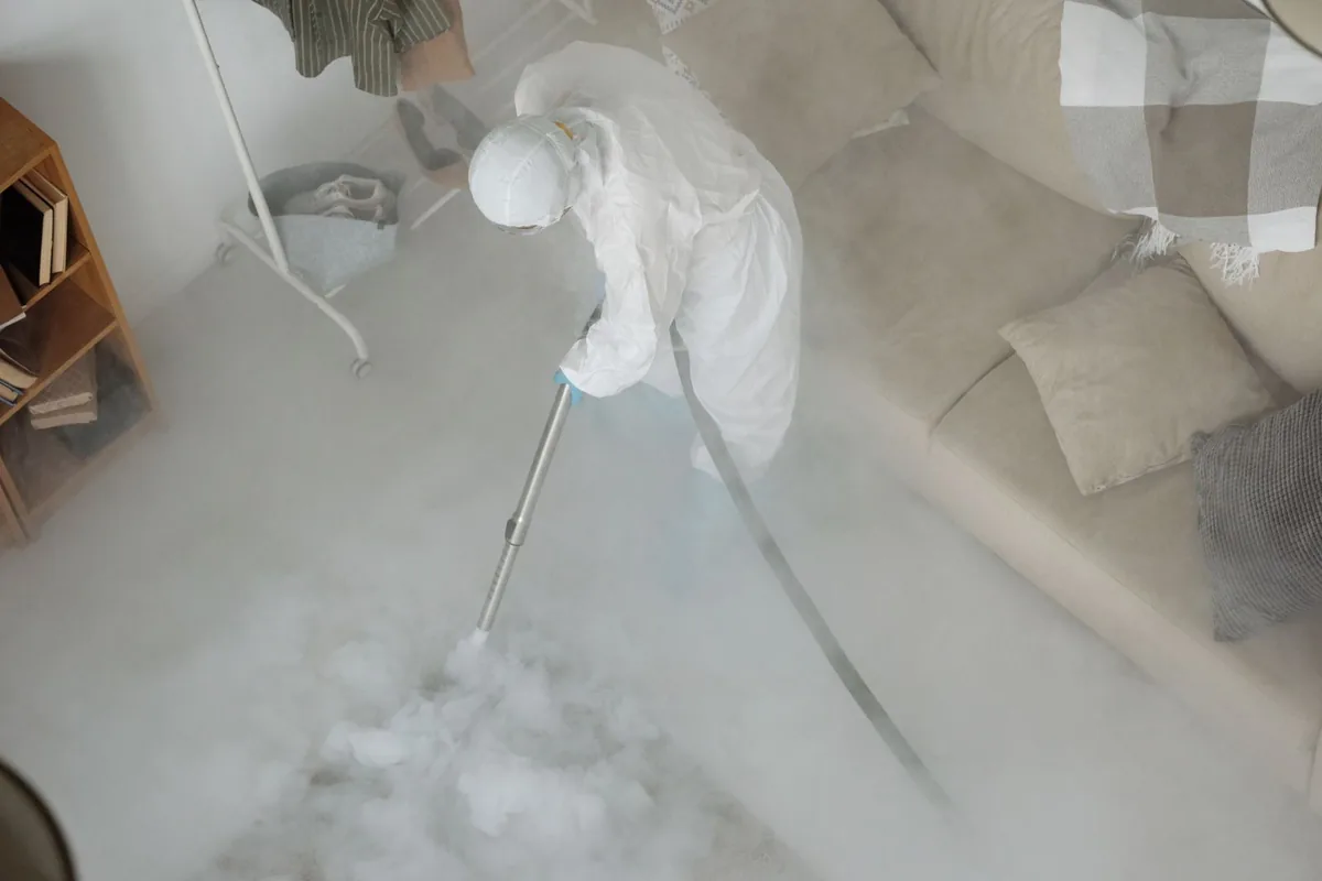 Biohazard cleanup technician in protective equipment, Three Forks, MT